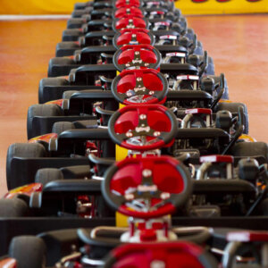 Indoor go-karting race at Kart Centrum Prague featuring high-speed karts, real Grand Prix grid-start atmosphere, private stag group racing experience