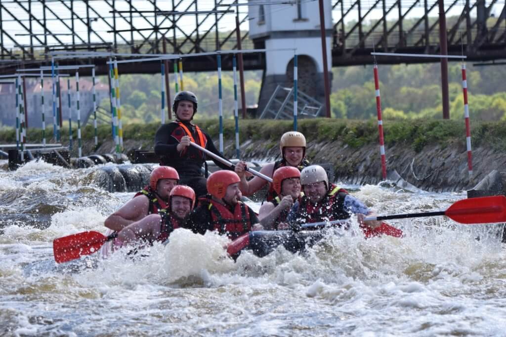 Group rafting on turbulent water - Prague White Water Rafting